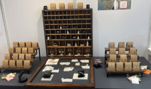 Table display of jewellery by Jacqueline Ready, including earrings, bracelets and rings in silver and gemstones.